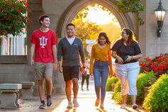 A small group of international students at the Sample Gates on the IU Bloomington campus.